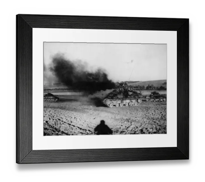 Framed Print : An American tank burns furiously after being taken out by a German tank in France