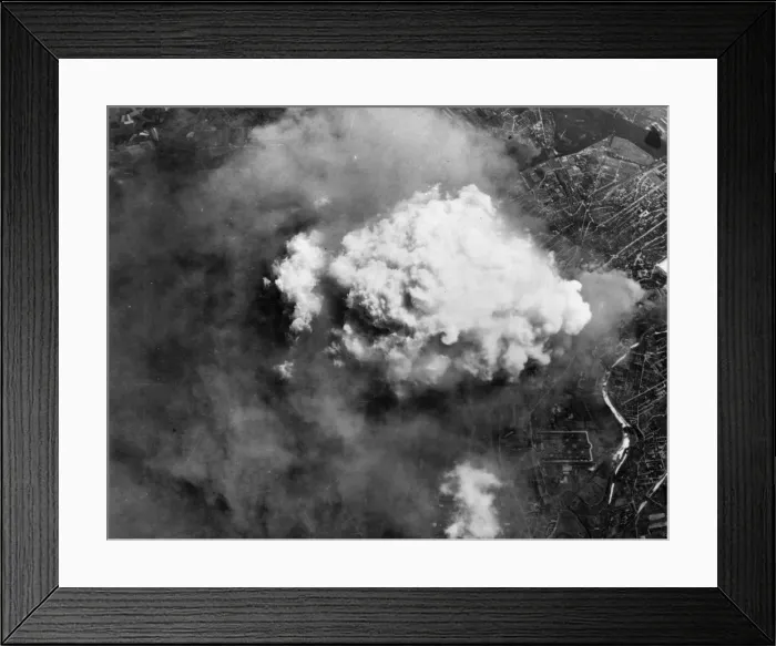 Framed Print : A Volcano of smoke spouts up from Hanovers sprawling tyre factories after a heavy Framed Print : A Volcano of smoke spouts up from Hanovers sprawling tyre factories after a heavy