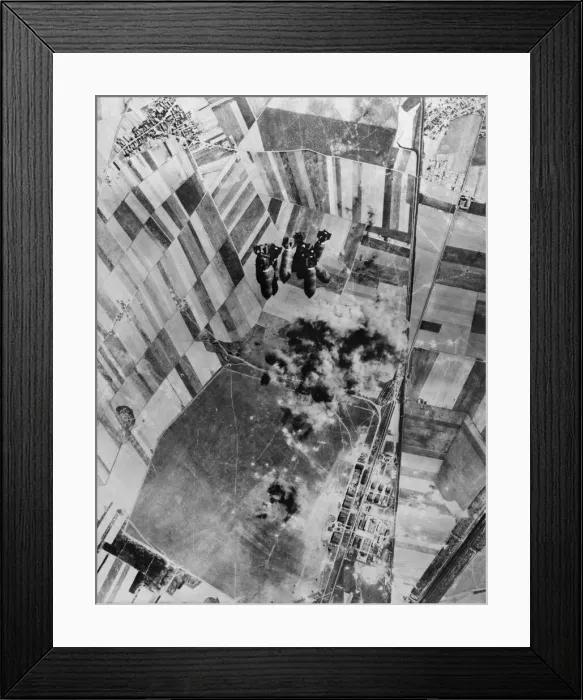 Framed Print : Four bay hangars, workshops, barracks and one large hangar were hard hit by Flying