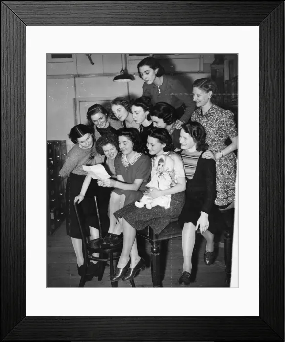 Framed Print : The group of young typists, who send out letters to the boys on the front Framed Print : The group of young typists, who send out letters to the boys on the front