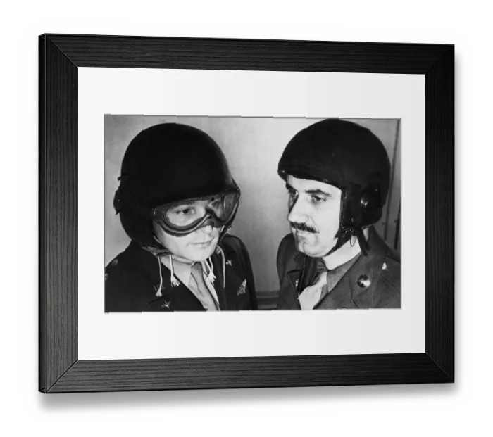 Framed Print : US Airmen model new protective helmets during Second World War. Circa 1944