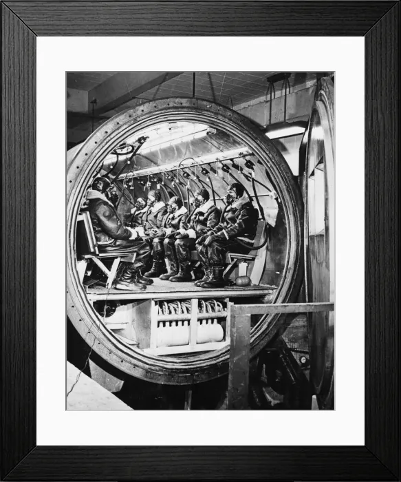Framed Print : Wearing oxygen masks and cold-weather flying gear these men are shown in the cold-weather