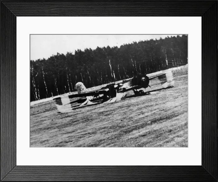 Framed Print : A German bomber on a Brandenburg airfield being strafed by Captain Nicolas Magura in his