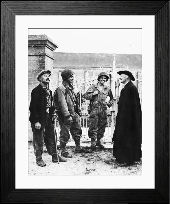 Framed Print : Two GIs chat with a French peasant and the padre of a church near Nueilly, France. P