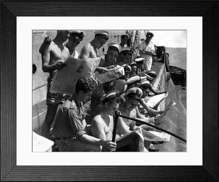 Framed Print : Royal Navy submariners in the Far East eagerly reading British Sunday newspapers Framed Print : Royal Navy submariners in the Far East eagerly reading British Sunday newspapers