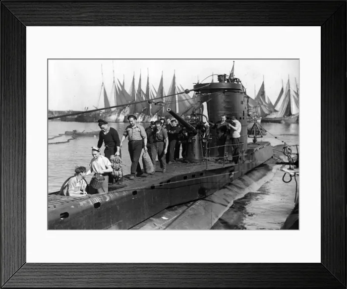 Framed Print : A crew taking stores aboard an Allied submarine. March 1945 Framed Print : A crew taking stores aboard an Allied submarine. March 1945