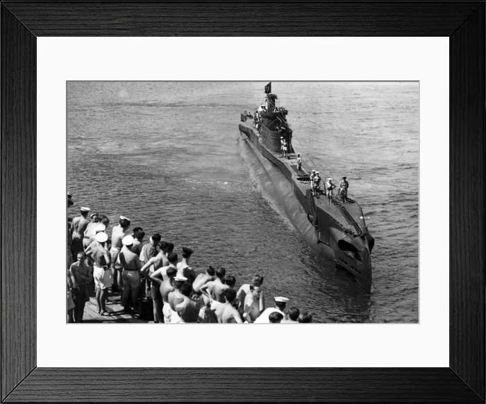 Framed Print : Back from a successful patrol in Far Eastern waters, a British submarine arrives back Framed Print : Back from a successful patrol in Far Eastern waters, a British submarine arrives back