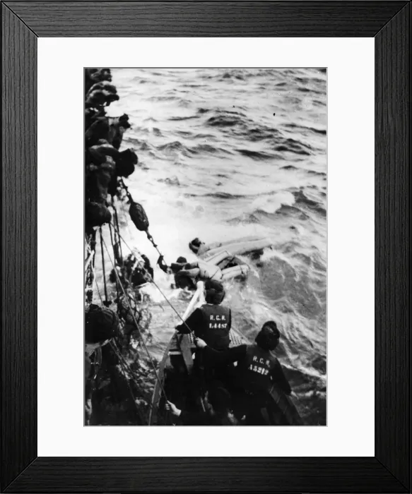 Framed Print : HMCS Swanseas seaboat alongside as U-boat survivors are helped out of the sea Framed Print : HMCS Swanseas seaboat alongside as U-boat survivors are helped out of the sea