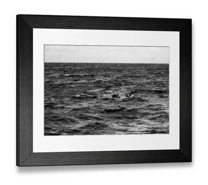 Framed Print : A U-boat sinks quickly and members of her crew, some in rubber dinghies, others swimming