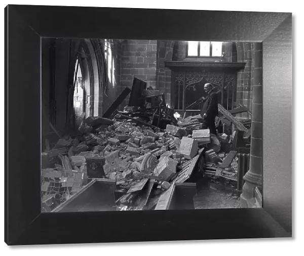 One of the church wardens surveys the damage to St Martins Church in the Bull Ring