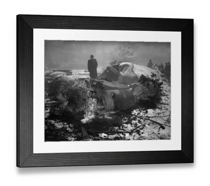 Framed Print : A member of the air Intelligence branch of the war office inspect the wreckage of a