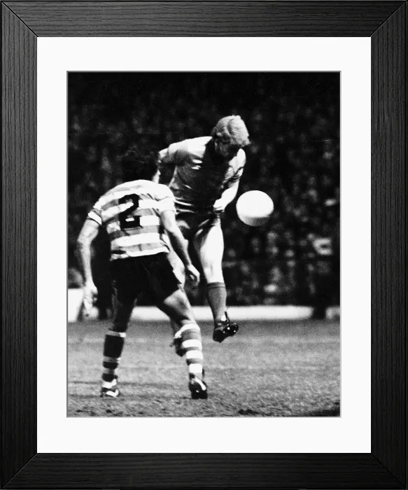 Framed Print : Tommy Burns footballer Celtic FC in UEFA Cup match heading the ball football strip