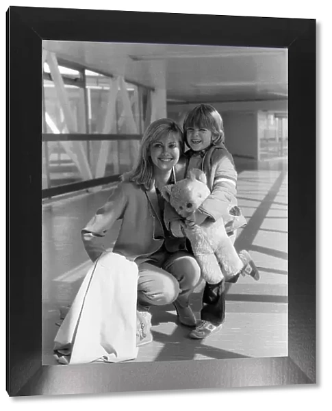 Olivia Newton John departing Heathrow Airport with her nephew Emerson. 23rd March 1979