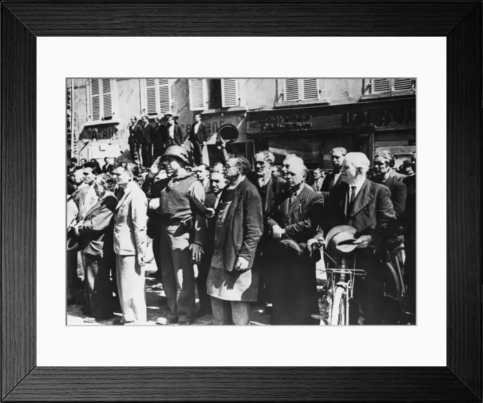 Framed Print : French civilians stand at attention and a GI salutes the American flag in Cherbourg