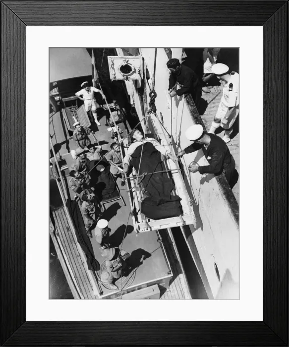 Framed Print : Patient being hoisted aboard the Maine from a hospital boat. 11th December 1943 Framed Print : Patient being hoisted aboard the Maine from a hospital boat. 11th December 1943