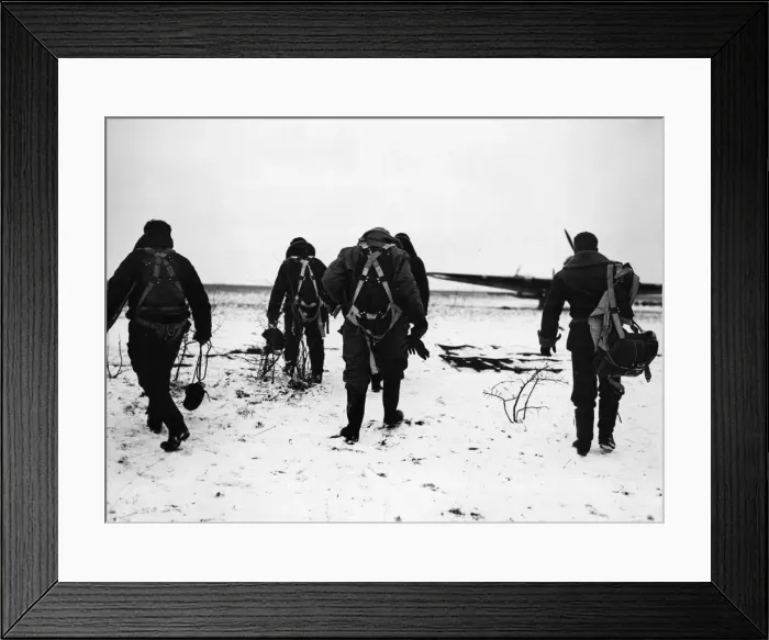 Framed Print : RAF pilots trudge through the snow to their aircraft on a French aerodrome for a flight Framed Print : RAF pilots trudge through the snow to their aircraft on a French aerodrome for a flight
