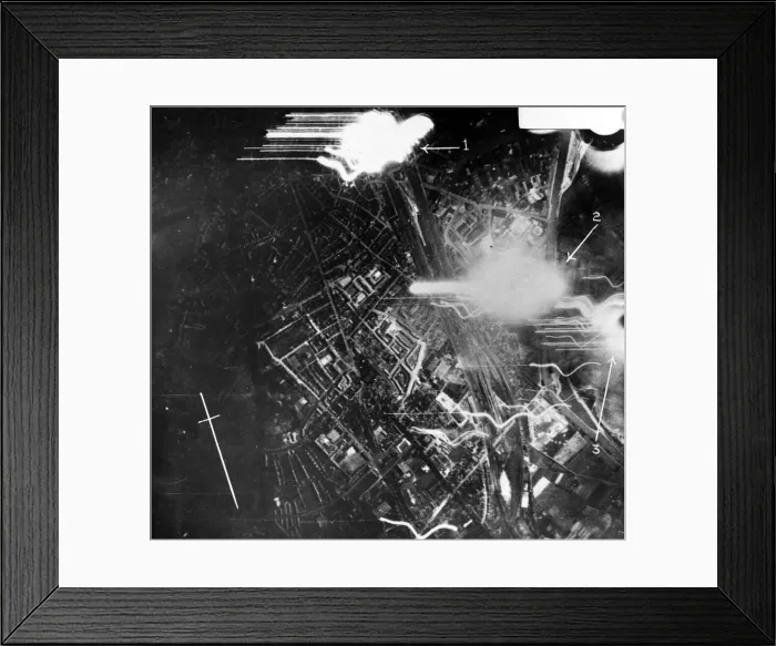 Framed Print : Night photograph taken from RAF bombers while making a heavy attack upon Munster