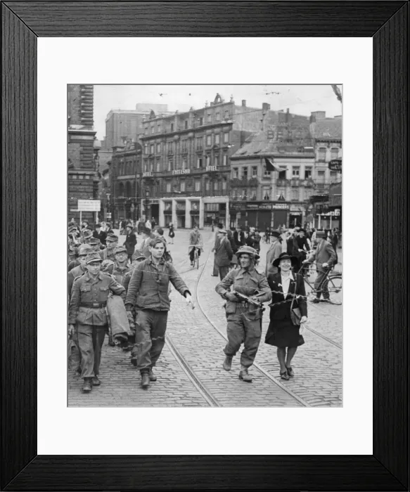 Framed Print : Liberated Antwerp, Belgium. Picture shows a local woman helping a British Framed Print : Liberated Antwerp, Belgium. Picture shows a local woman helping a British