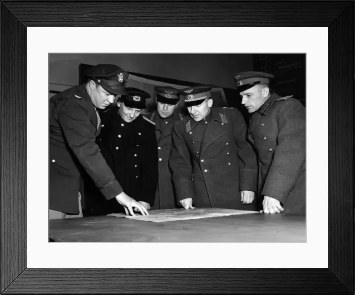 Framed Print : Russian Air Force visitors refer to an air chart for a discussion of air tactics