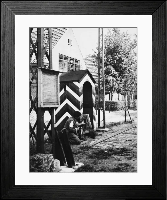 Framed Print : First British troops to enter Germany. A Sherwood ranger crouches by the side of Framed Print : First British troops to enter Germany. A Sherwood ranger crouches by the side of