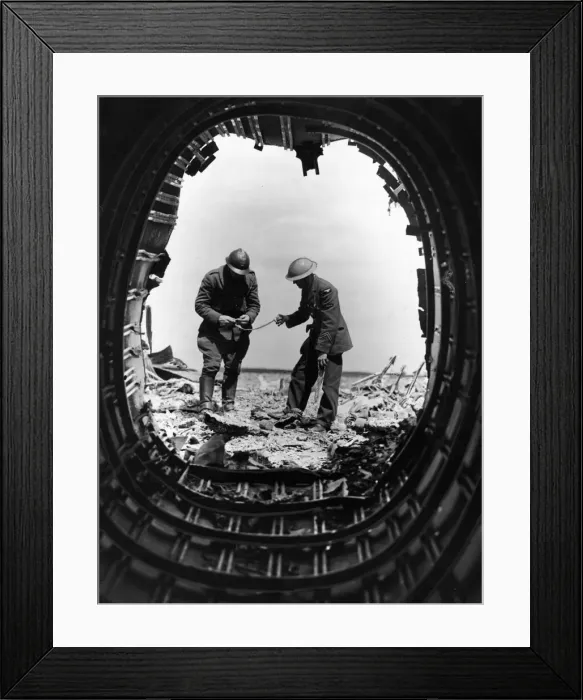 Framed Print : A Belgian soldier and a British airman examine the wreckage of a Heinkel bomber brought Framed Print : A Belgian soldier and a British airman examine the wreckage of a Heinkel bomber brought
