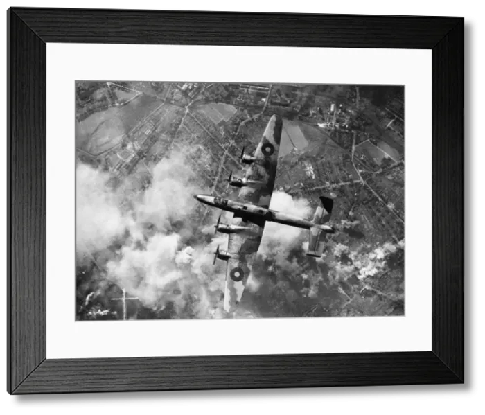Framed Print : A Halifax bomber of RAF Bomber Command in flight over the target area during a raid Framed Print : A Halifax bomber of RAF Bomber Command in flight over the target area during a raid