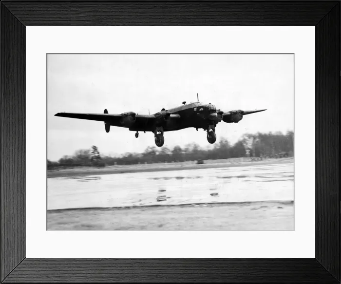 Framed Print : A Halifax bomber landing after a night raid over Italy during the second World War