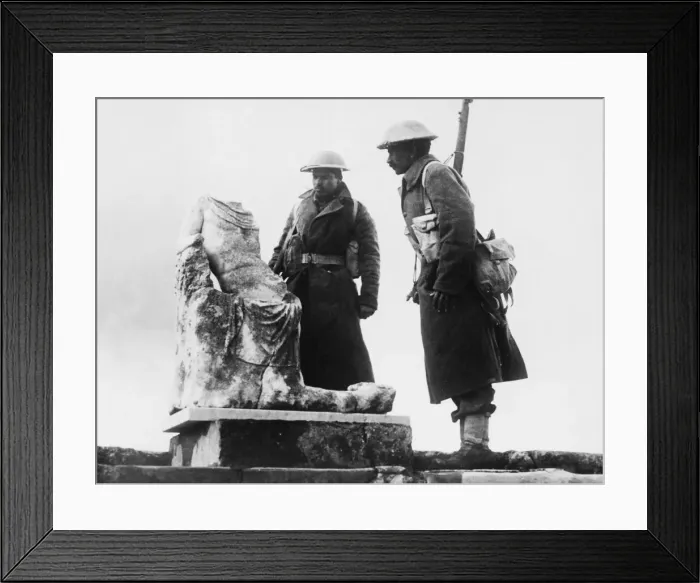 Framed Print : Two Rajput riflemen looking at a piece of archaic statuary in the ruins of the ancient Framed Print : Two Rajput riflemen looking at a piece of archaic statuary in the ruins of the ancient