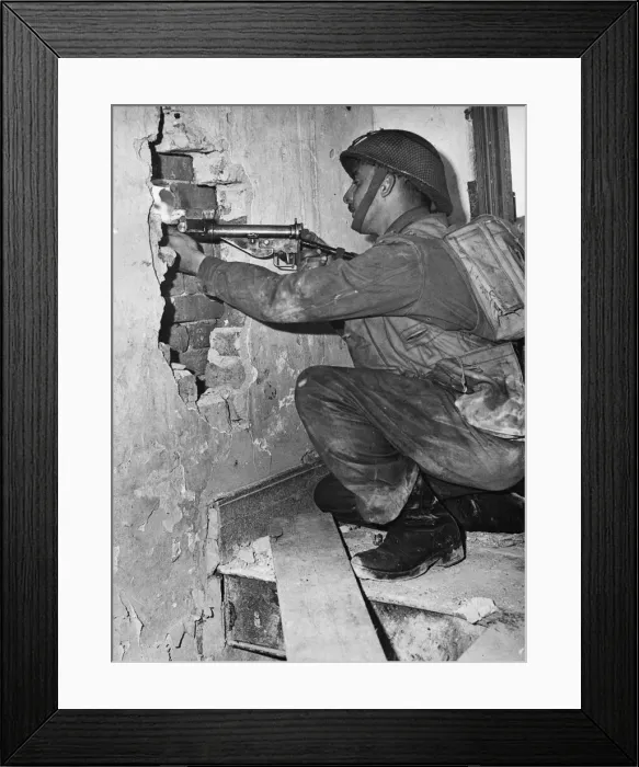Framed Print : Canadian soldier Corporal Andy Mouflier from Winnipeg, fires a peephole in the wall of a Framed Print : Canadian soldier Corporal Andy Mouflier from Winnipeg, fires a peephole in the wall of a