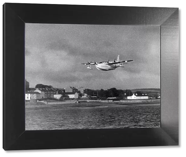 A Sunderland Flying Boat spreads its wings over the Pembrokeshire village of Neyland as
