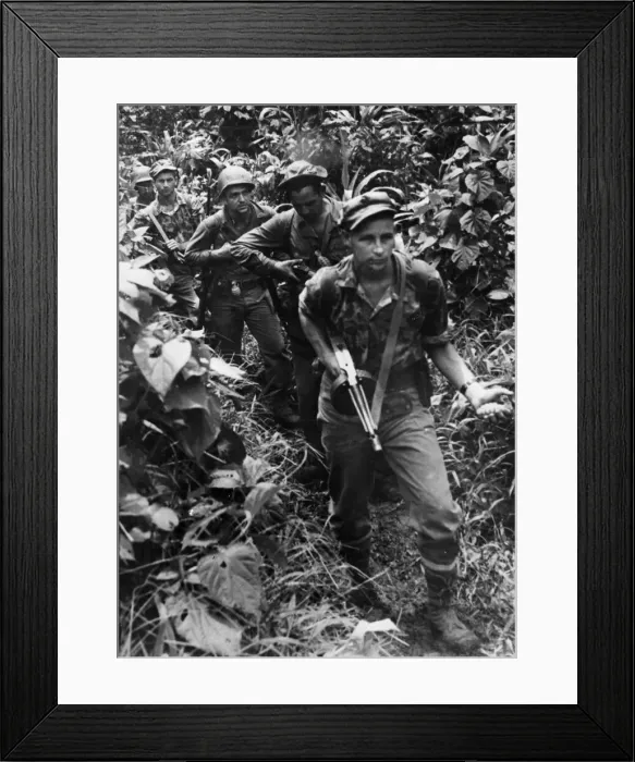 Framed Print : A sub-machine gun in one hand and a grenade in the other Framed Print : A sub-machine gun in one hand and a grenade in the other