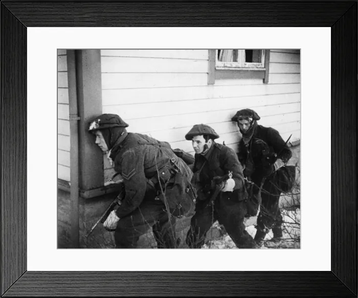 Framed Print : British Warships and bombers and Commandos'were landed under cover of smoke
