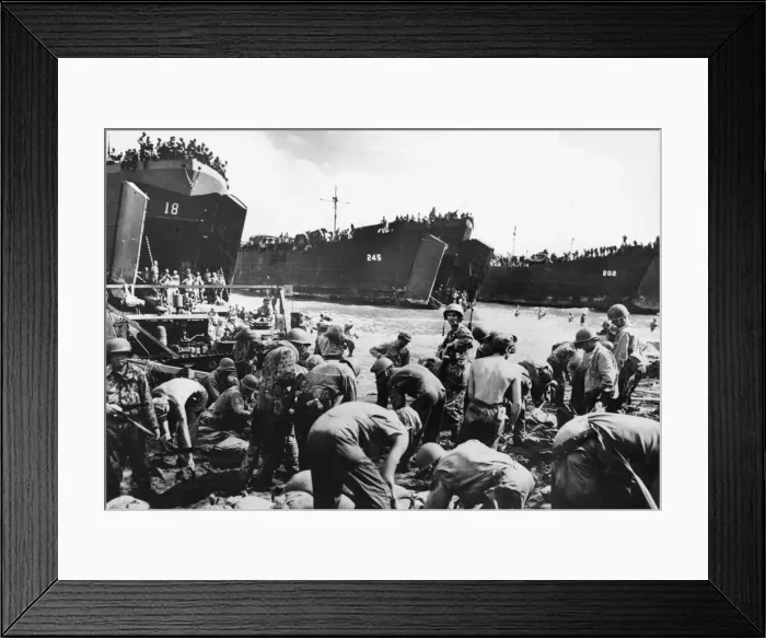 Framed Print : While the gaping bow doors of amphibious assault craft spew forth more men and supplies Framed Print : While the gaping bow doors of amphibious assault craft spew forth more men and supplies