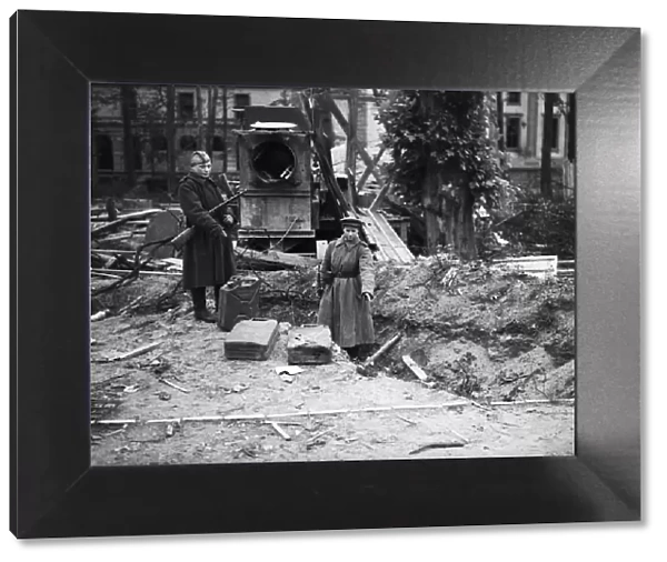 Russian soldiers examine the trench in the Reich Chancellery Gardens, Berlin