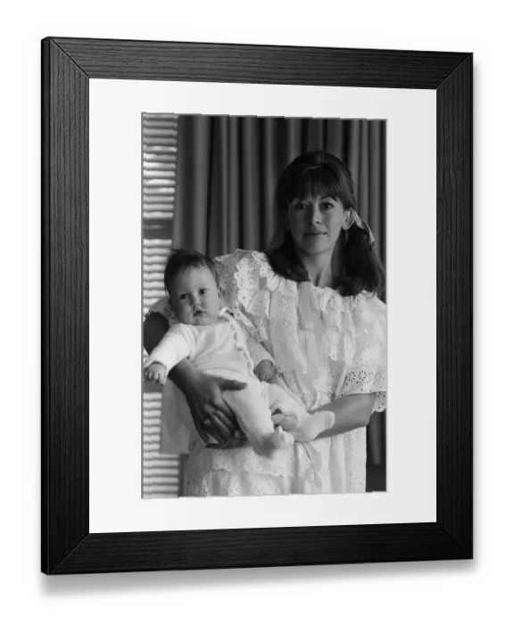 Framed Print : Actress Nanette Newman with her 4 month old daughter Emma at their home in Virginia Water
