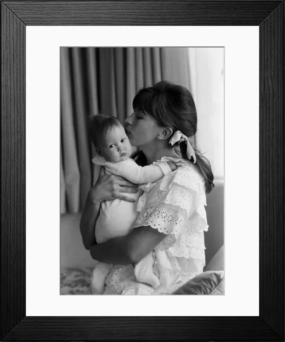 Framed Print : Actress Nanette Newman with her 4 month old daughter Emma at their home in Virginia Water