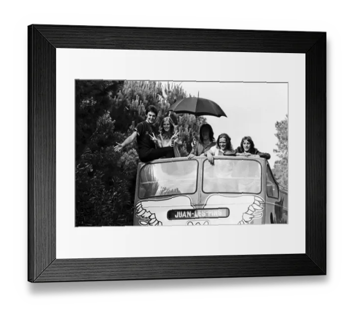 Framed Print : Paul McCartney and his wife Linda in Paris, France, with other members of the group Wings