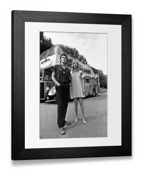 Framed Print : Paul McCartney and his wife Linda in Paris, France, with other members of the group Wings
