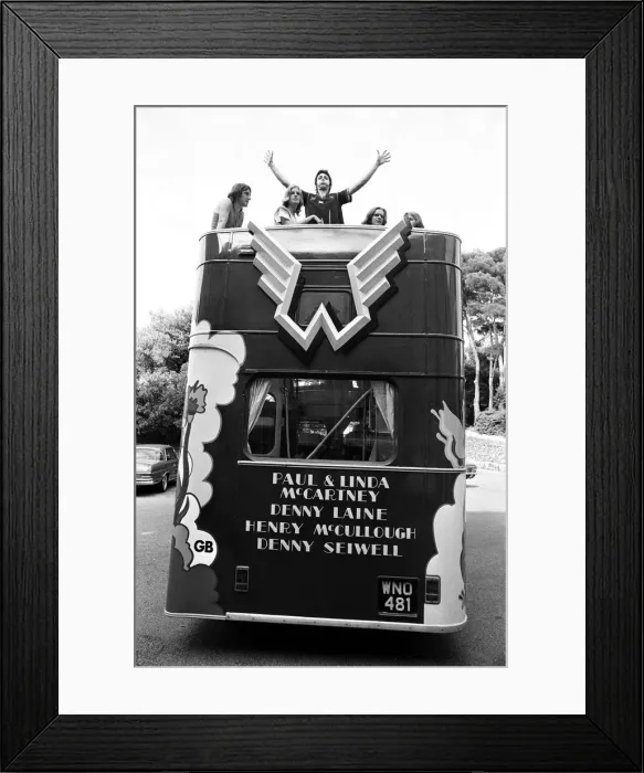 Framed Print : Paul McCartney and his wife Linda in Paris, France, with other members of the group Wings