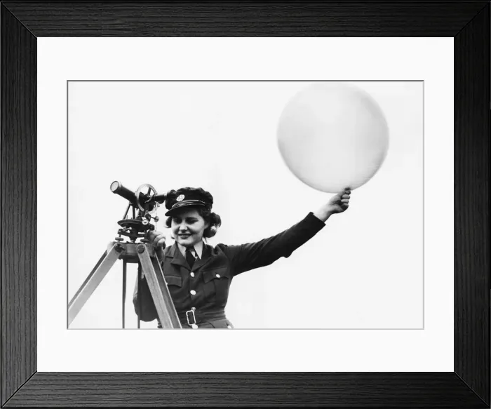 Framed Print : A W. A. A. F. meteorologist releasing a met balloon. 9th October 1941 Framed Print : A W. A. A. F. meteorologist releasing a met balloon. 9th October 1941