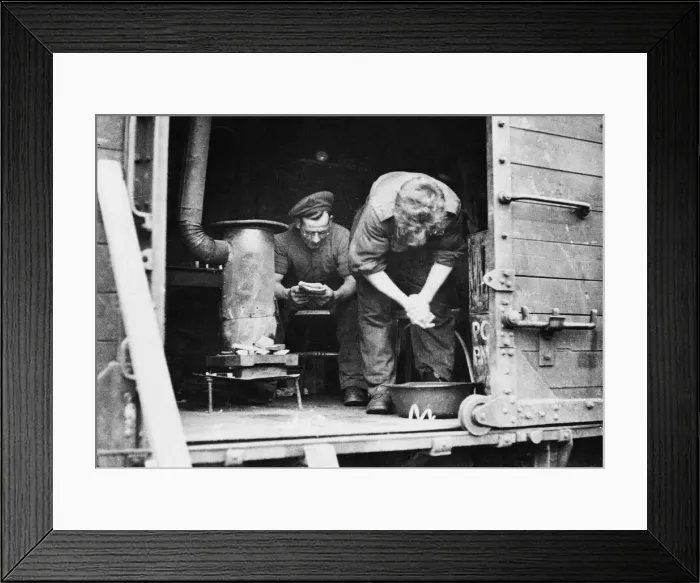 Framed Print : British soldiers in their makeshift home; Sapper Remington spends his spare time in a Framed Print : British soldiers in their makeshift home; Sapper Remington spends his spare time in a