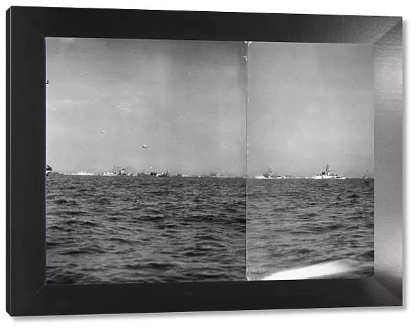 A panoramic view showing the great armada of warships and merchantmen standing by before