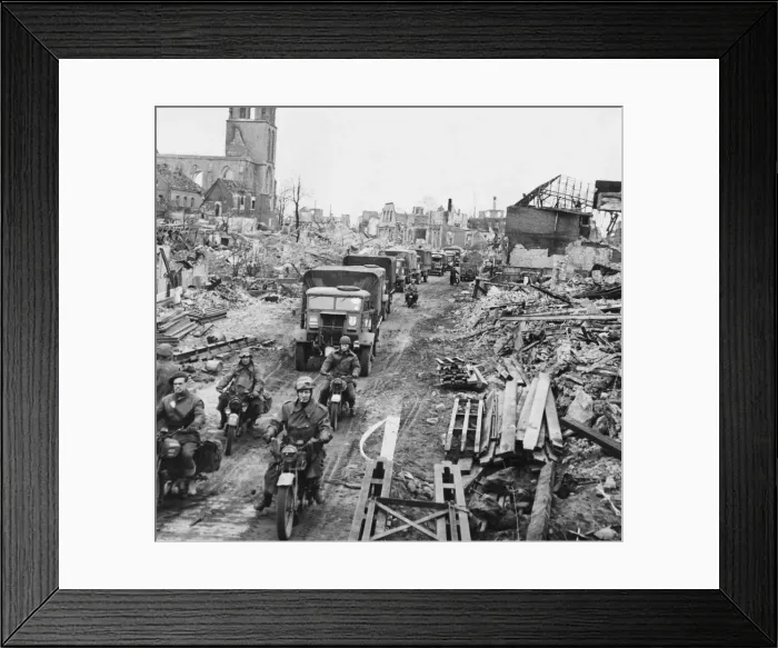 Framed Print : British troops and transport moving through the cleared streets of Stadtlohn, Germany Framed Print : British troops and transport moving through the cleared streets of Stadtlohn, Germany
