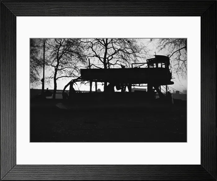 Framed Print : The shell of a tram caught in the blast from a bomb on Victoria Embankment, London Framed Print : The shell of a tram caught in the blast from a bomb on Victoria Embankment, London