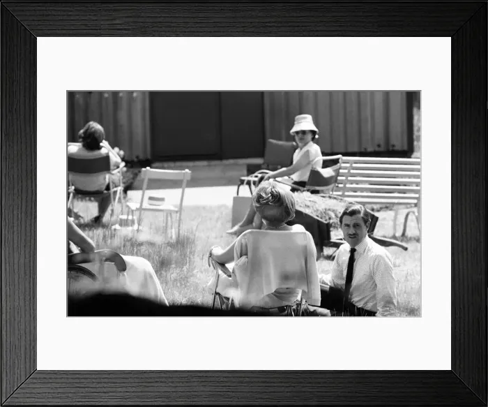Framed Print : Graham Hill talking to his friend Stirling Moss, who is recovering at the Atkinson Morley Framed Print : Graham Hill talking to his friend Stirling Moss, who is recovering at the Atkinson Morley
