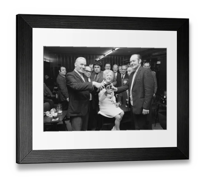 Framed Print : Barmaid retires in Billingham, enjoying a celebration drink with customers, 1973