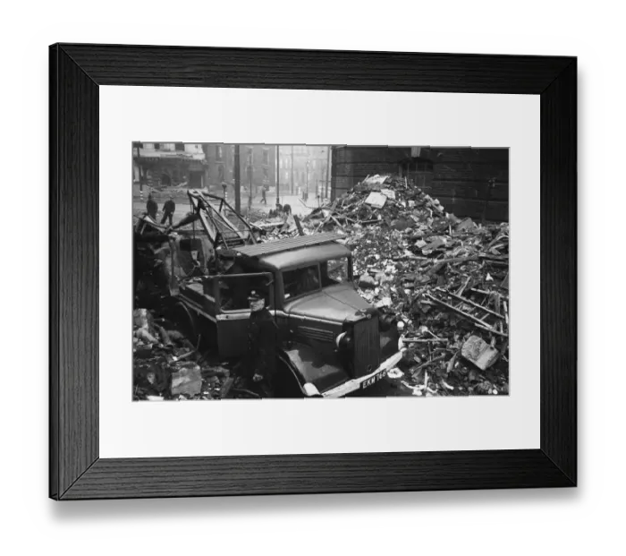 Framed Print : Firefighters clear fire appliances, hoses and ladders buried under debris at Carreras
