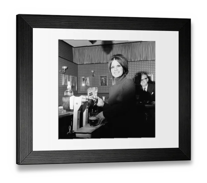 Framed Print : Barmaid at the The Dragonara, Hotel, Middlesbrough, 1974, Photocall