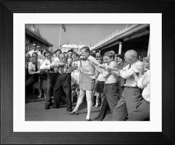 Framed Print : Daily Mirror reporter Eric Wainwright accepted a challenge from the strong man Framed Print : Daily Mirror reporter Eric Wainwright accepted a challenge from the strong man
