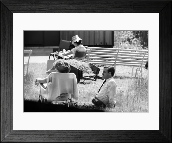 Framed Print : Graham Hill talking to his friend Stirling Moss, who is recovering at the Atkinson Morley Framed Print : Graham Hill talking to his friend Stirling Moss, who is recovering at the Atkinson Morley